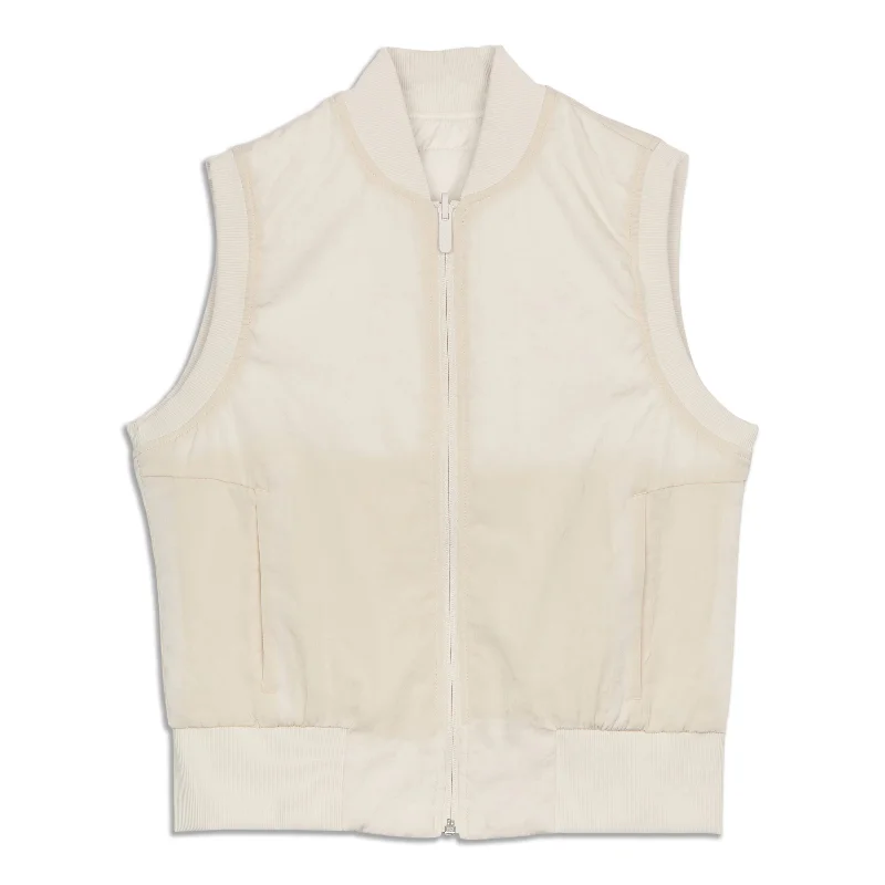 Long women's mac coats in a lightweight fabric for spring showersNon-Stop Bomber Vest Long women's mac coats in a lightweight fabric for spring showersNon-Stop Bomber Vest