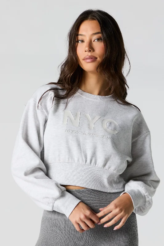 Women's hoodie with a kangaroo pocket and a pom - pom drawstring for added charmCity Embossed Cropped Fleece Sweatshirt Women's hoodie with a kangaroo pocket and a pom - pom drawstring for added charmCity Embossed Cropped Fleece Sweatshirt