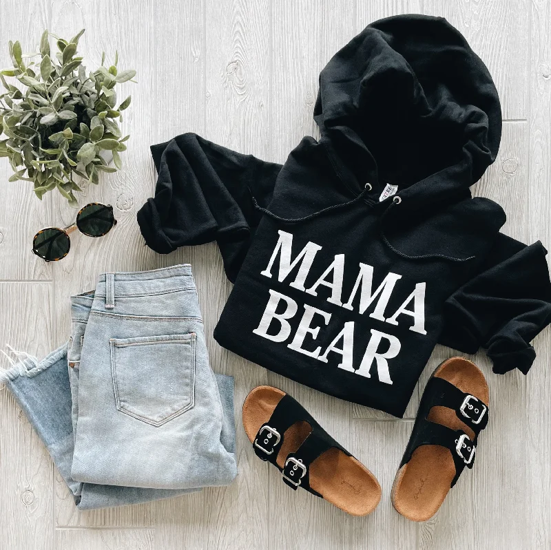 Women's cropped sweatshirt with a slogan graphic for a fun and expressive lookMAMA BEAR • Black Hoodie Women's cropped sweatshirt with a slogan graphic for a fun and expressive lookMAMA BEAR • Black Hoodie