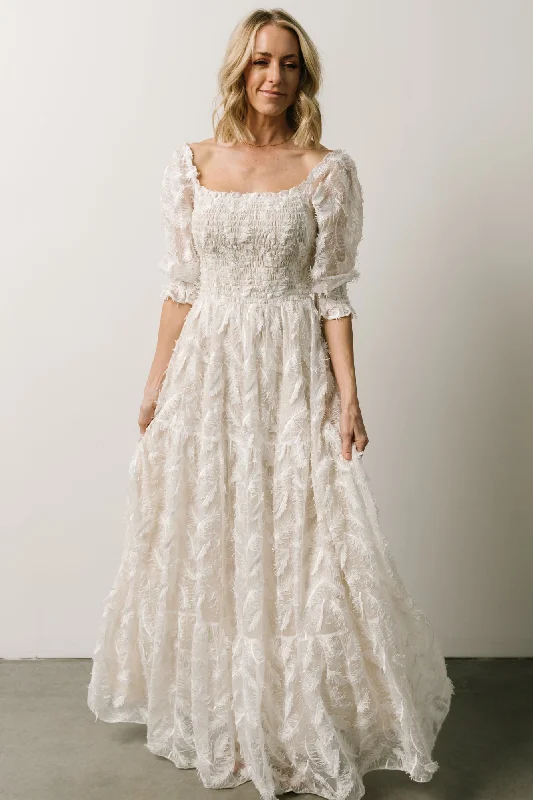 Maxi dresses with bow accents at the waist for a sweet appearancePaloma Smocked Feather Maxi Dress | Off White Maxi dresses with bow accents at the waist for a sweet appearancePaloma Smocked Feather Maxi Dress | Off White