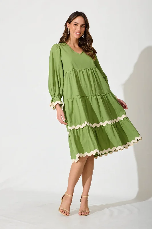 Midi dresses with button - front designs for a classic touchRamona Midi Smock Dress In Green Cotton With Ric Rac Trim Midi dresses with button - front designs for a classic touchRamona Midi Smock Dress In Green Cotton With Ric Rac Trim