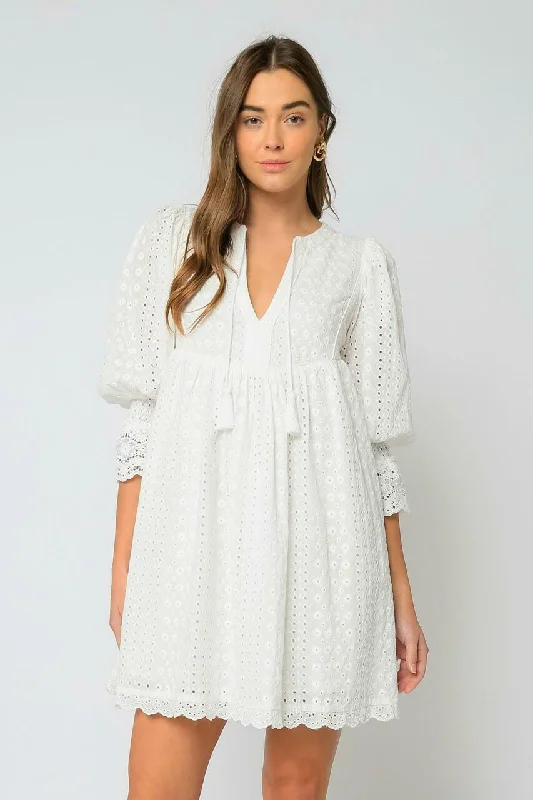 Mini wedding guest dresses with glittery accents for a trendy lookEdwina White Eyelet Shift Dress
